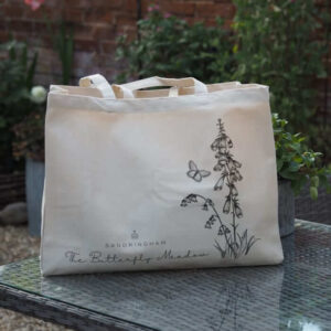 Bag with Sandringham in writing and a butterfly with some flowers