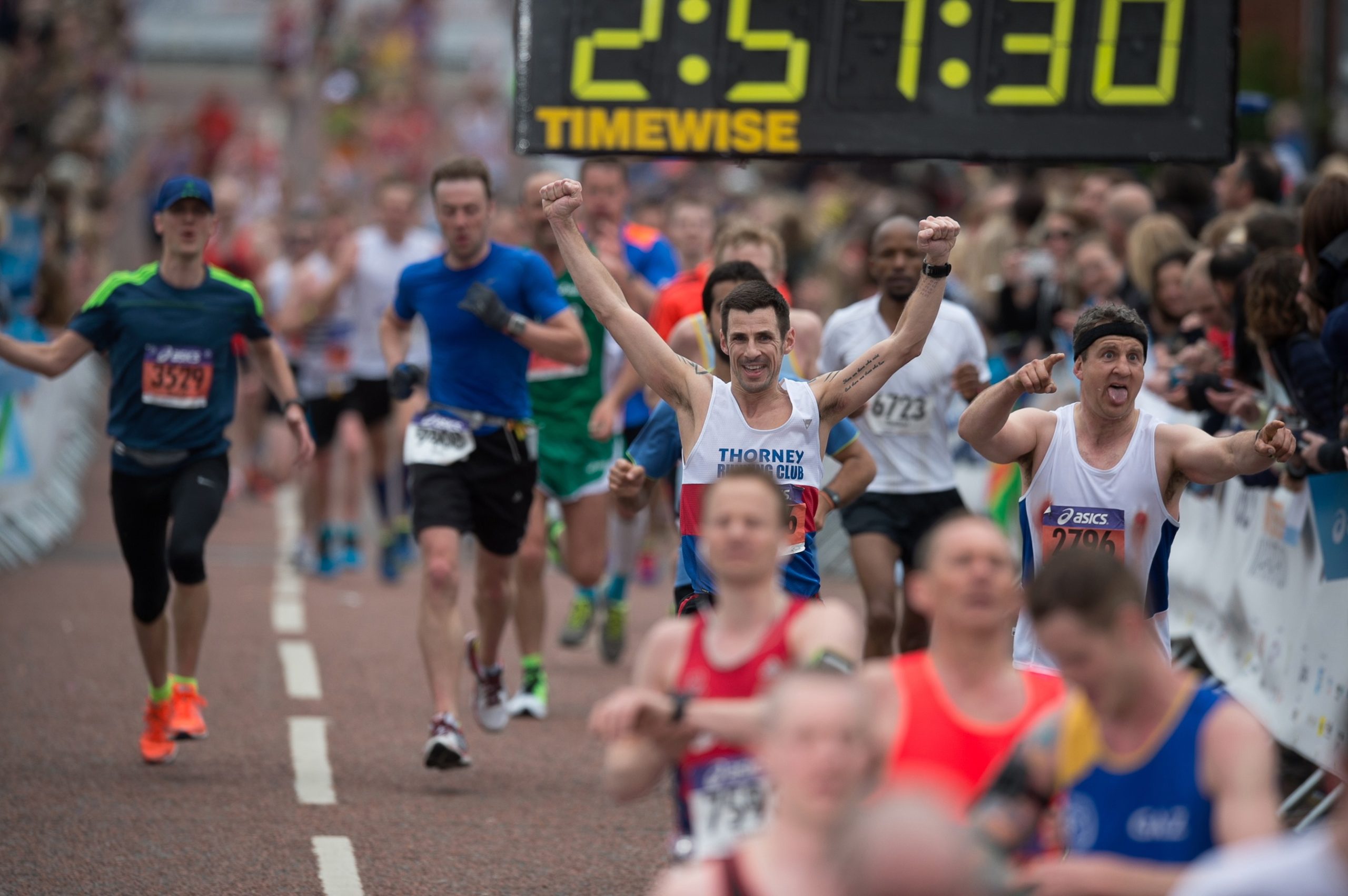 Half marathon runners cheering
