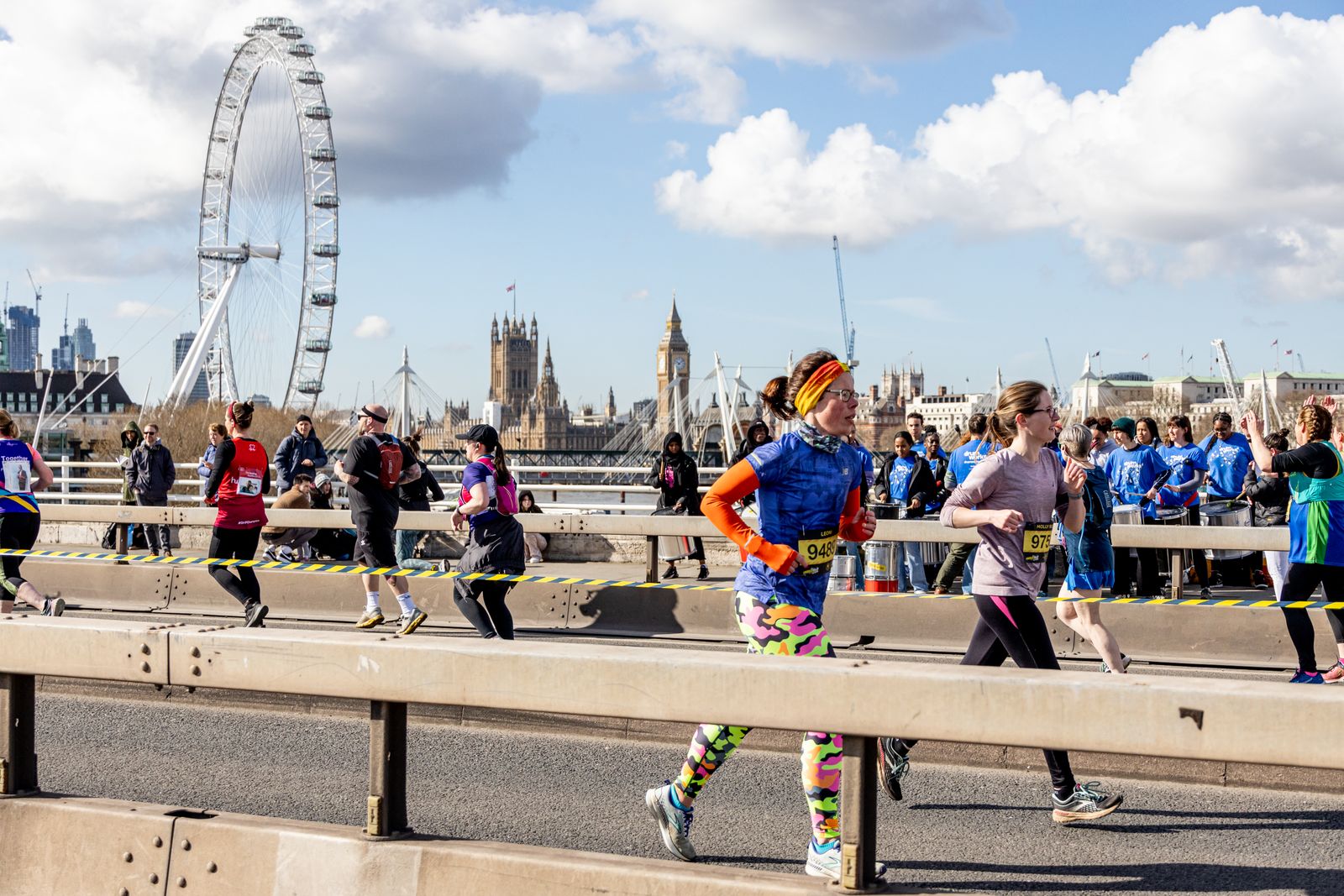 Runners moving past the London Eye during Half Marathon fundraising